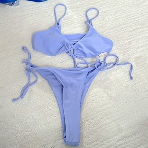small cheeky bum 2-piece bikini. Adjustable shoulders & tie waist. Lilac size S